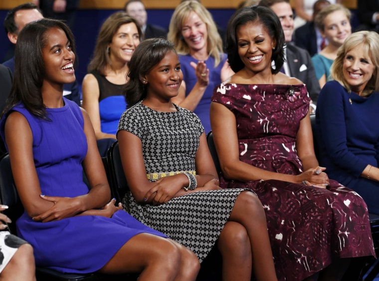 Image: The president's daughters Malia, Sasha and first lady Michelle Obama listen to U.S. President Barack Obama accept the 2012 U.S Democratic presidential nomination with Jill Biden during the final session of Democratic National Convention in Charlott